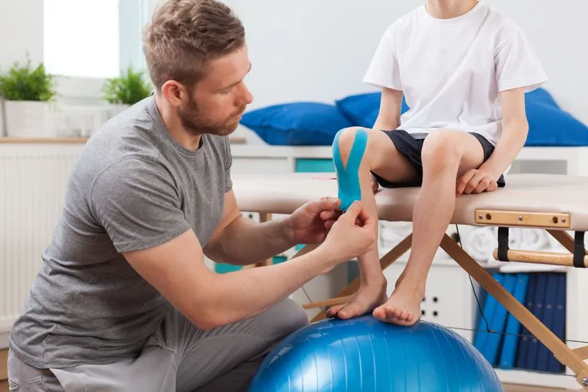 Physical therapists working on child