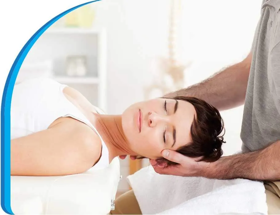 Woman receiving head massage from therapist